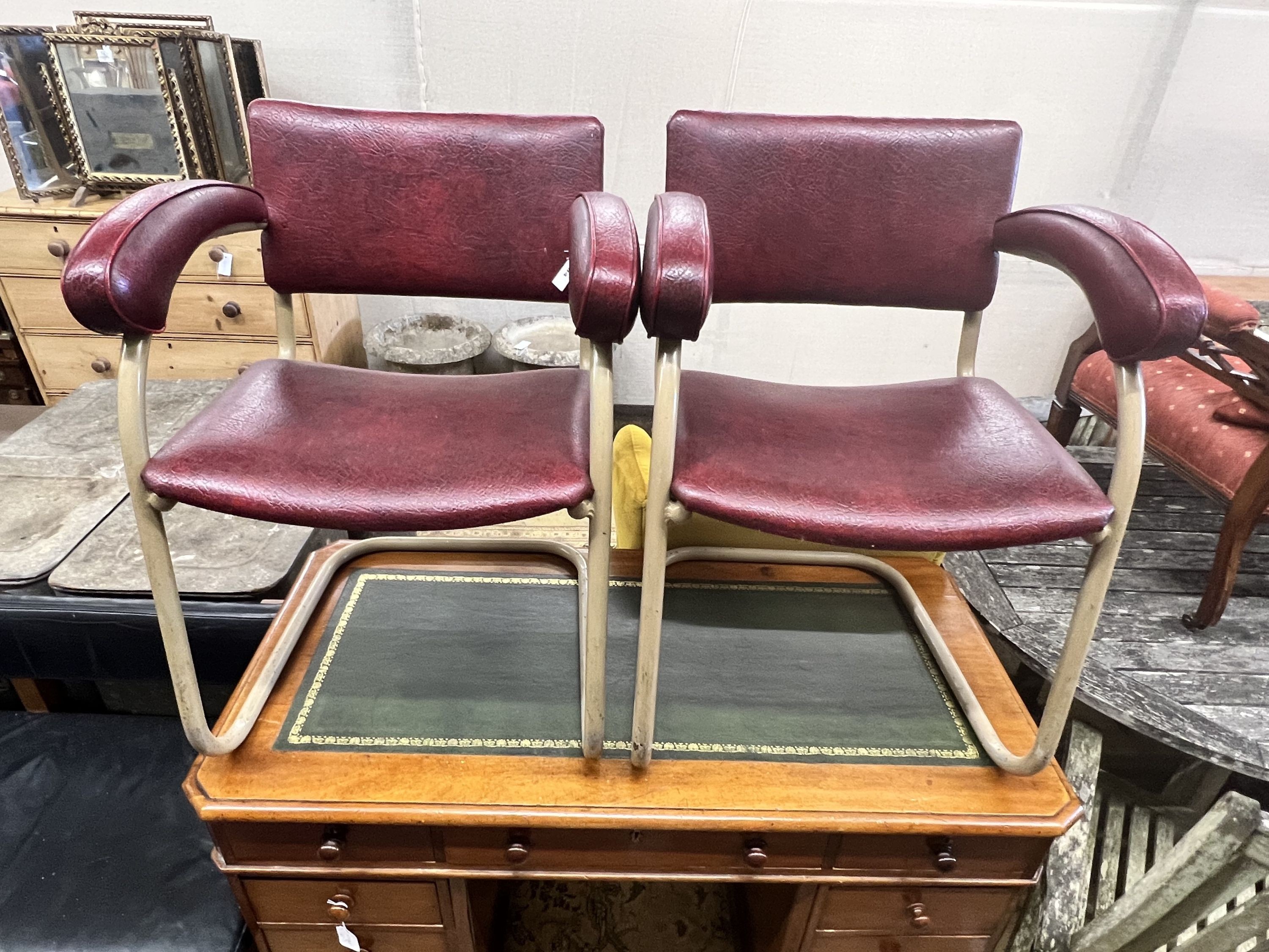 A pair of Pell elbow chairs, width 56cm depth 44cm height 78cm